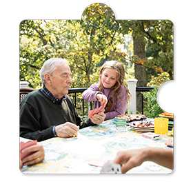 Family Playing Cards On The Deck<br />
