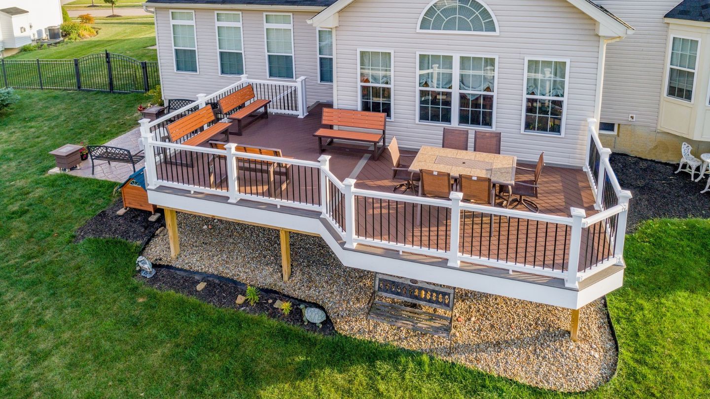 Beautiful Deck With White Railings And Outdoor Furniture 