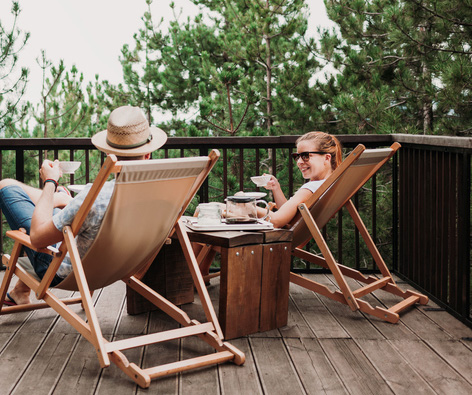People Relaxing On Deck In The Outdoor