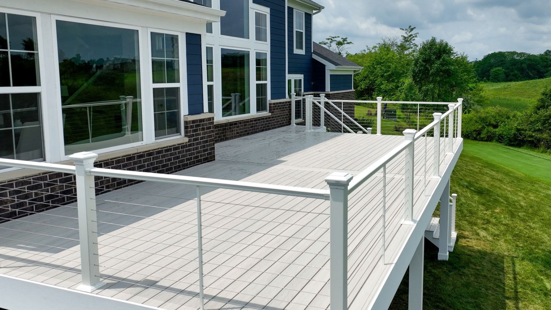 Elevated Deck With Light Composite Boards And Cable Railing