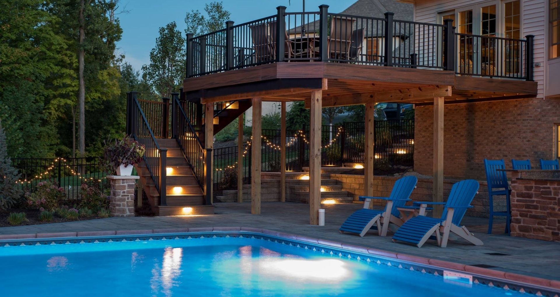 Backyard With Pool, House, And Decking Area