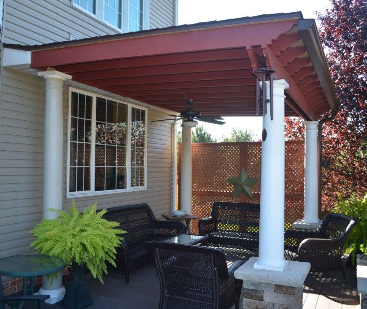 Red Wood Patio Cover With White Pillars And Ceiling Fan
