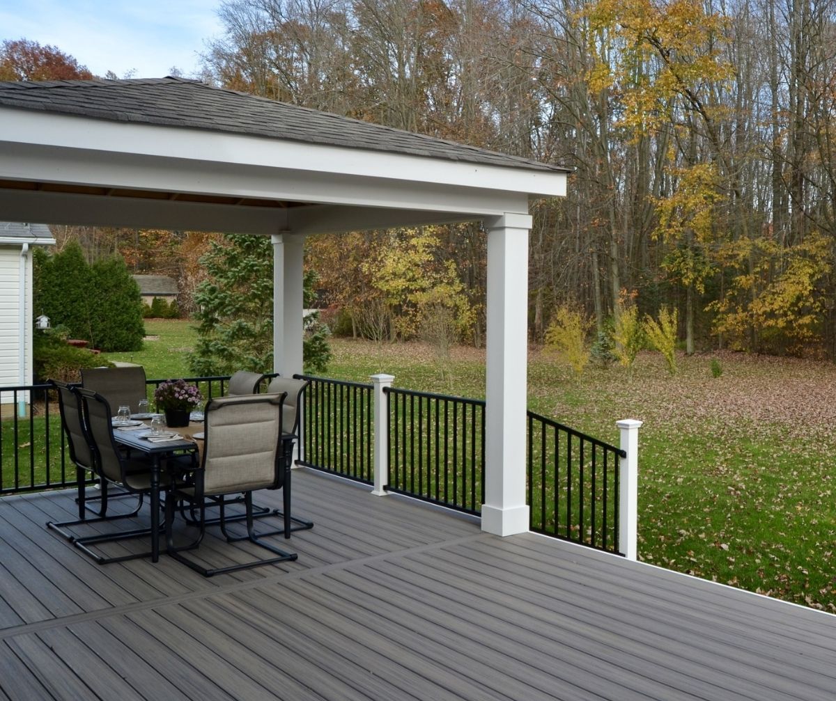 White Gabled Patio Cover Over A Gray Composite Deck
