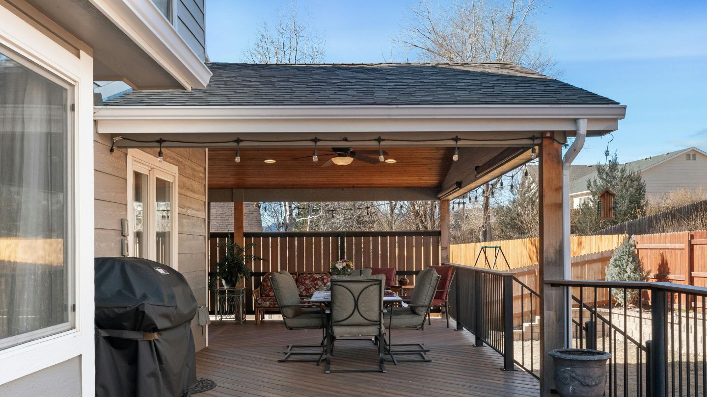 Covered Backyard Deck With Dining Furniture