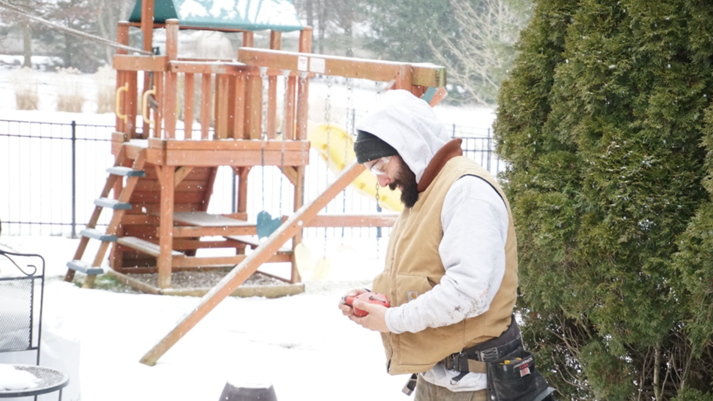 Professional Deck Builder Measuring Installation Area